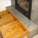 custom drawers under fireplace